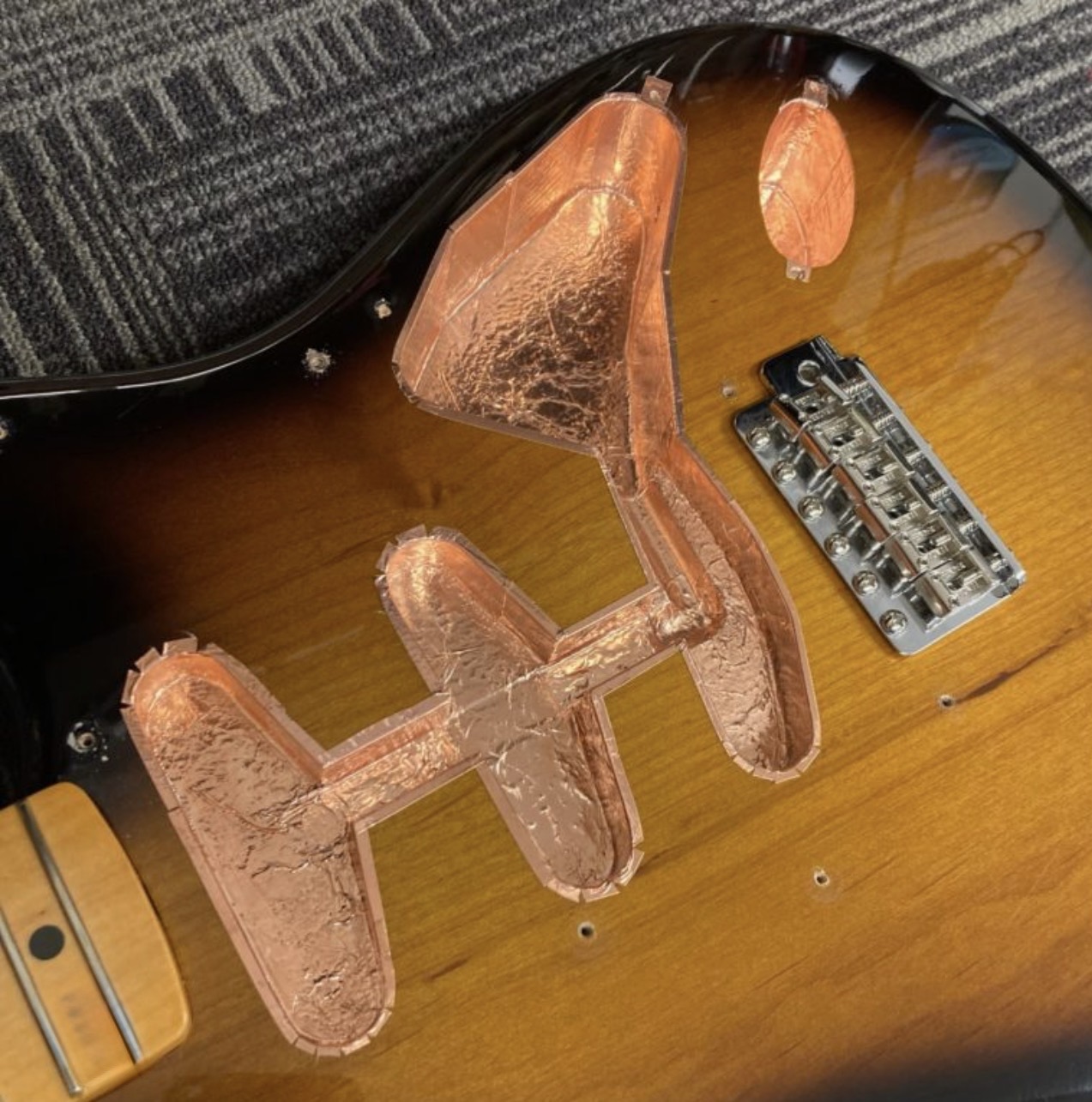 Foil shielding installation inside guitar cavity